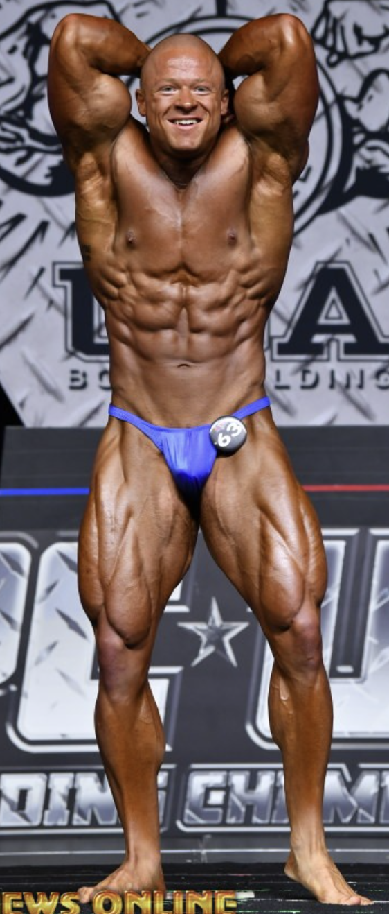 Bodybuilder, front double bicep at NPC Championships